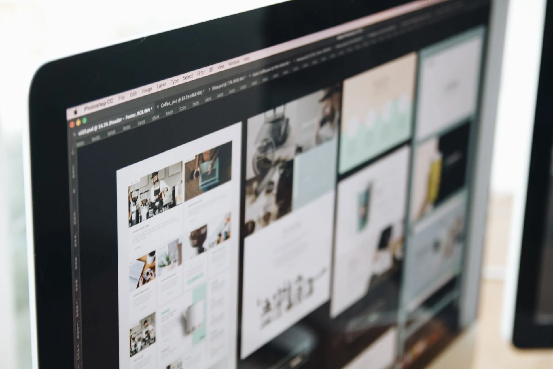 Web designer working on a website at a laptop